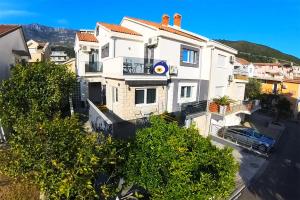 an aerial view of a white house at Villa Montemaris Budva in Budva