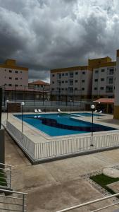 a large swimming pool in front of a building at Cantinho de paz in Santarém