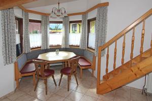 a dining room with a table and chairs at Acherkogelblick in Oetz