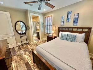 a bedroom with a bed and a ceiling fan at 1953 Villa Lago in Destin +41 photos