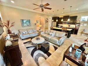 a living room with a couch and a table at 1953 Villa Lago in Destin