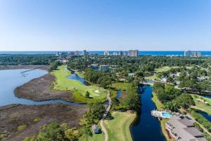 an aerial view of the golf course at the resort on lake detroit at 1953 Villa Lago in Destin