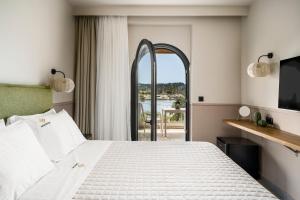 Postel nebo postele na pokoji v ubytování Loadstar Rooms & Suites + 26 fotografií