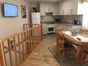 a kitchen with a table and a kitchen with a dining room at La casa de Manuel en Ortigueira in A Coruña +21 photos