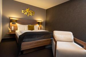Llit o llits en una habitació de V Boutique Hotel Böblingen