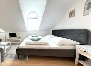 a bedroom with a large bed in a attic at Vienna Excellent Apartments in Vienna