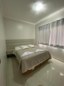 Postel nebo postele na pokoji v ubytování North Hotel - Aeroporto