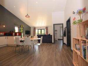 a dining room and living room with a table and chairs at 3 Bed in Penzance 1.5 mls 75635 in Gulval