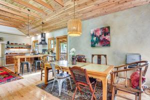 a dining room with a wooden table and chairs at Unique and Serene Retreat, 7 Mi to Downtown Portland in Portland