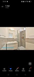 a bathroom with a shower and a sink at B&B Iris in Santa Maria di Castellabate