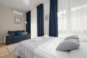 Posteľ alebo postele v izbe v ubytovaní Sarmacka 25 studio 1 close to Medicover and Paley