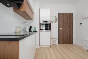 Kuchyňa alebo kuchynka v ubytovaní Sarmacka 25 studio 1 close to Medicover and Paley
