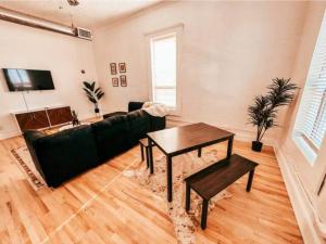 a living room with a couch and a table at The Yellowrose in Waxahachie