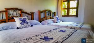 Postel nebo postele na pokoji v ubytování Hotel Ocho Barrios