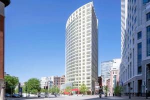 a tall white building in the middle of a city at Downtown 1BR w Gym WD nr S Station BOS-618 in Boston