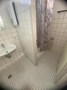 a bathroom with a shower and a sink at Kapitän Dallmann str.14 in Bremen