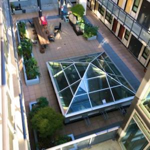 an overhead view of a building with a glass window at Best Choice Apartment in Vancouver