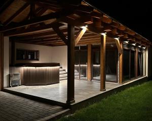 a pavilion with a stage in a house at night at Pensiunea Andres in Sovata