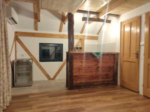 a room with a wooden door in a room at Seoski turizam Ziličina Rogatica in Rogatica