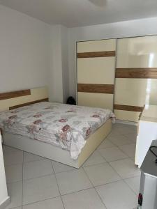 a bedroom with a bed in a room at Arber apartments Zeqiraj in Shëngjin