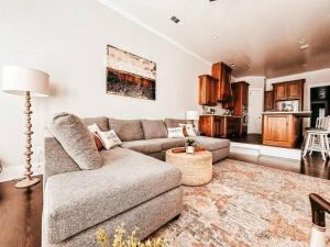 a living room with a couch and a table at Buffalo Creek Loft Downtown in Waxahachie