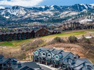 an aerial view of a resort with houses and mountains at Walk to Gondola! Lux Canyons Village Living with Private Hot Tub in Park City