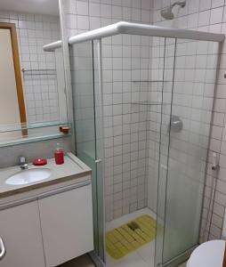 a bathroom with a shower and a sink at Malawi Beach Resort - Flat SKY in Porto De Galinhas