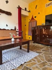 a living room with a couch and a table at Spitia Katoi in Palaiochora