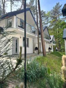 a house with a view of the front of it at PROFIL Family House in Pogorzelica