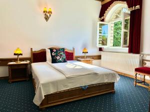 Postel nebo postele na pokoji v ubytování Éllő Residence