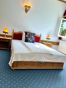 Postel nebo postele na pokoji v ubytování Éllő Residence