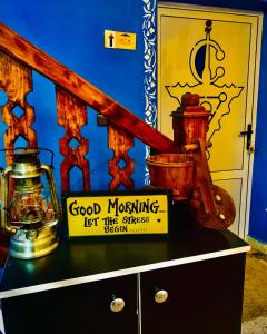 a dresser with a sign on top of it at Hôtel Riad Atlas Dades in Boumalne Dades