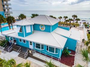 an overhead view of a blue house with the ocean in the background at Beach access close to Walmart, Bowling,skating and Game room in Panama City Beach