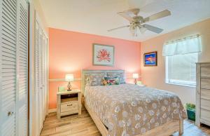 a bedroom with a bed and a ceiling fan at Waterfront Hernando Beach Home with Dock and Hot Tub! in Hernando Beach