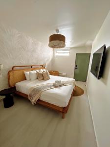 En eller flere senge i et værelse på Bali Poshtel PR
