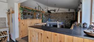 a kitchen with wooden cabinets and a counter top at Paradiesli in Castelo de Penalva