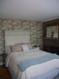 The Inn at Sugar Hill tesisinde bir odada yatak veya yataklar