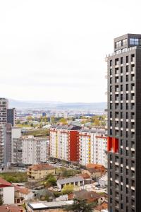 an aerial view of a city with tall buildings at Apartment 5 in Pristina
