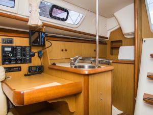 a kitchen in a boat with a sink in it at Bed on Boat 32021 corfu in Agios Rokkos