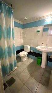 a bathroom with a toilet and a sink at Olympia in Kfardebian +25 photos