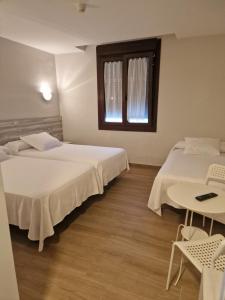 Postel nebo postele na pokoji v ubytování Hotel La Quinta