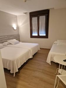 Postel nebo postele na pokoji v ubytování Hotel La Quinta