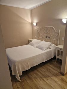 Postel nebo postele na pokoji v ubytování Hotel La Quinta