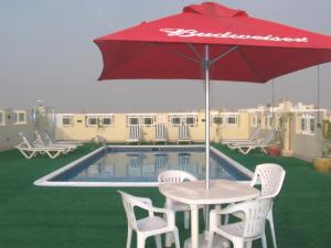 The swimming pool at or close to Benta Grand Hotel LLC