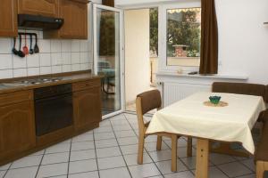 a kitchen with a table with a table cloth on it at Apartment Mandre 4098d in Mandre