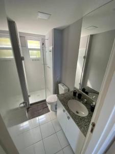 a bathroom with a sink and a shower and a toilet at Porto Real Resorts - Apartamento com Vista in Mangaratiba