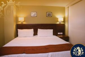 Postel nebo postele na pokoji v ubytování Hotel Posada del Virrey