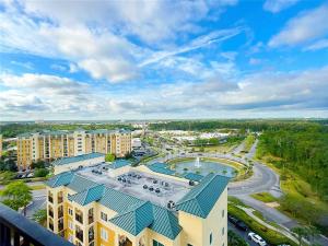 an aerial view of a resort with a pool and buildings at Spider-Man-themed condo near Disney, Sea World, Universal and OCCC with pool, spa, restaurants, shuttle, private balcony, and view of fireworks shows in Orlando
