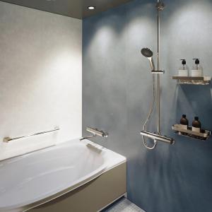 a bathroom with a bath tub and a shower at Grand Mercure Okinawa Cape Zanpa Resort in Yomitan