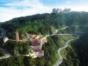 a building on the side of a mountain with a road at First World Hotel in Genting Highlands